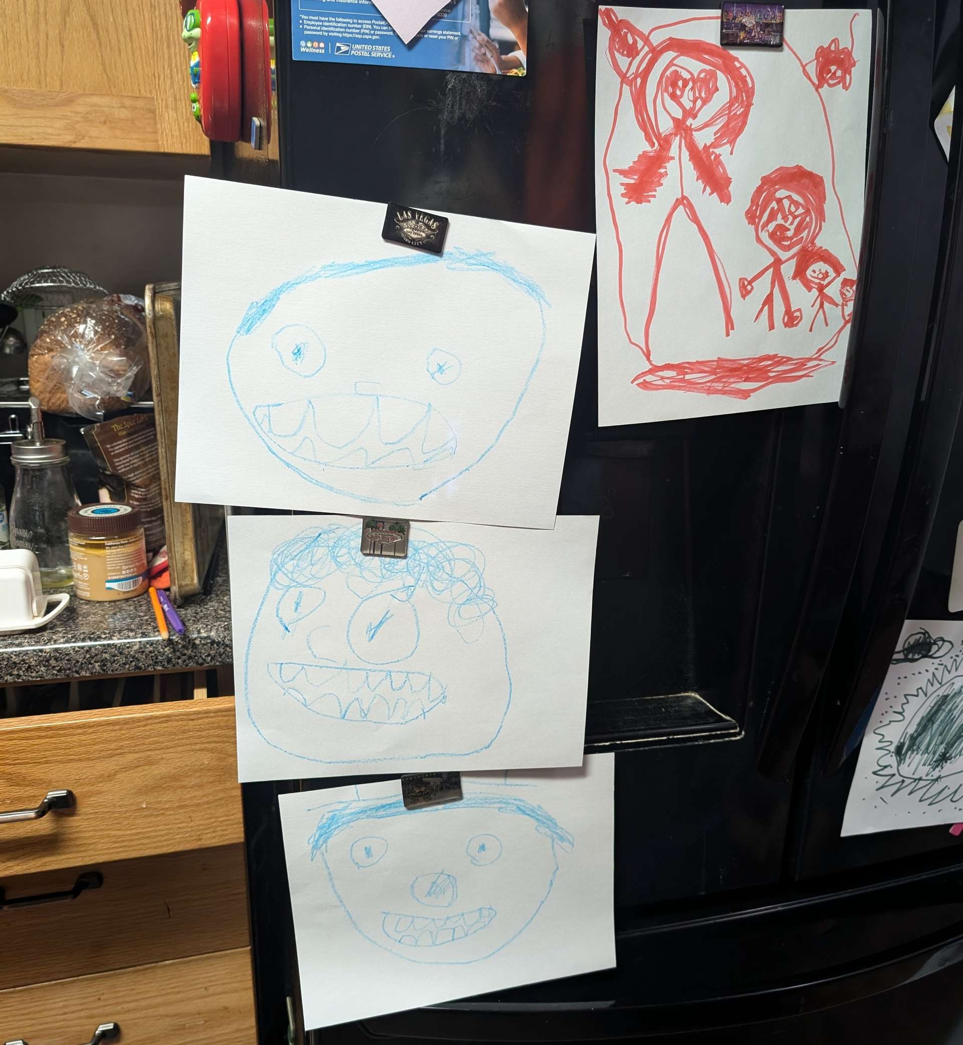Photo of children's artwork taking over a refrigerator